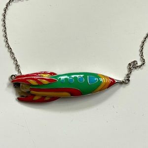 Sterling silver Artist made rocket ship necklace in like new condition.